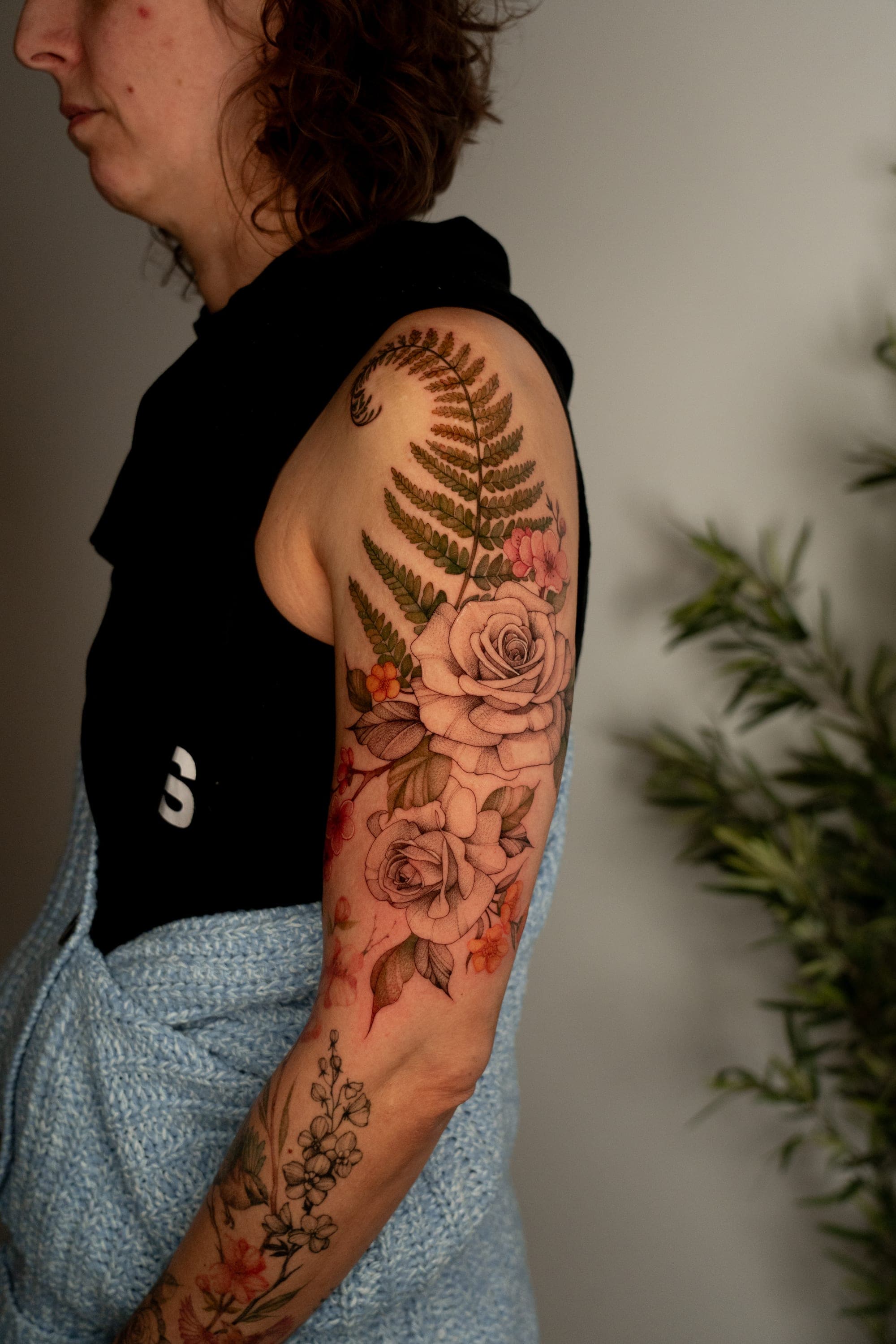 Fern and rose sleeve tattoo